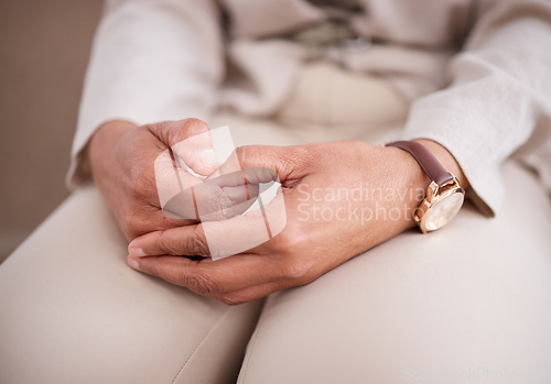 Image of Hands, depression or anxiety with a woman patient closeup on a sofa for mental health or psychology. Stress, healthcare and medical with a nervous female person sitting in an office of a psychologist