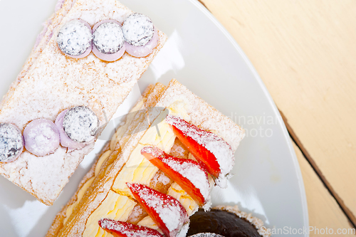 Image of selection of fresh cream cake dessert plate