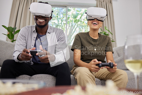 Image of Virtual reality, happy couple and gaming on sofa in home living room, bonding together or having fun. Vr, couch and African man and woman play 3d game, metaverse or esports with futuristic technology