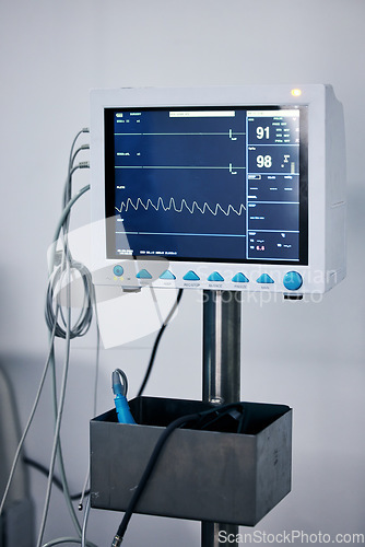 Image of Medical monitor, heart machine and healthcare, cardiology and equipment with stats and vitals in hospital. Medicine, health information and wellness, digital and screen with EKG and ECG in clinic