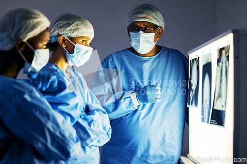 Image of Dentist team, teeth x ray and monitor for analysis, study and learning in clinic for healthcare. Surgeon group, skull and jaw with tooth growth for wellness, care or focus with discussion in hospital