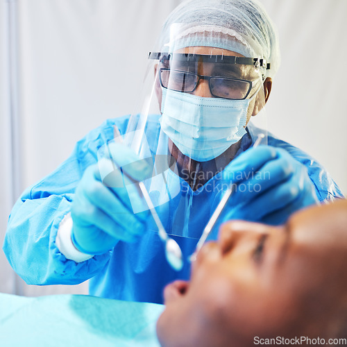 Image of Dentist, consultation and man check patient mouth, dental healthcare and medical procedure at clinic. PPE, dentistry and orthodontics treatment, male person with oral care tools and teeth whitening