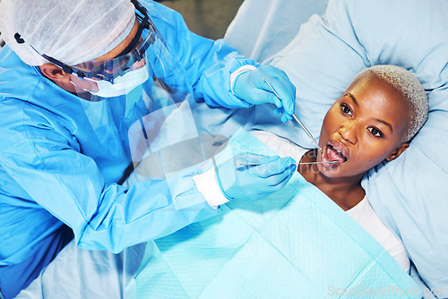 Image of Dentist, woman and tools in mouth at clinic for cavity, teeth whitening and helping hand for pain. Dental surgeon, patient and top view for tooth extraction, wellness or inspection for healthy smile