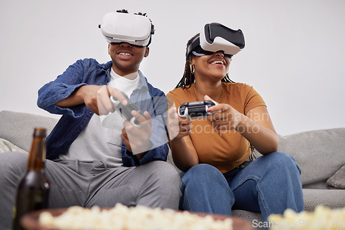 Image of Happy, playing and a couple with vr games, metaverse glasses and digital competition on the sofa. Smile, home and a black man and woman with future technology for a gaming experience on the couch