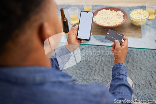 Image of Credit card, mockup and man with phone screen for online shopping, sale and home streaming subscription payment, transaction or membership. Ecommerce, banking and male with smartphone app for savings