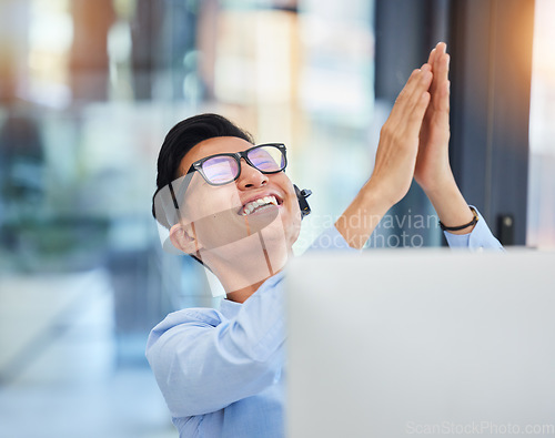 Image of Telemarketing, applause and Asian man with celebration, call center and sales target with achievement. Male person, agent and consultant with headphones, clapping and excited with growth and success