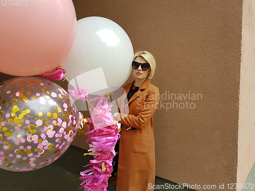 Image of Young fashion happy blonde woman with baloons ,fashion photo, instagram filter