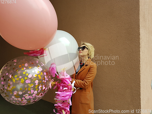 Image of Young fashion happy blonde woman with baloons ,fashion photo, instagram filter