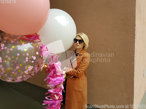 Image of Young fashion happy blonde woman with baloons ,fashion photo, instagram filter