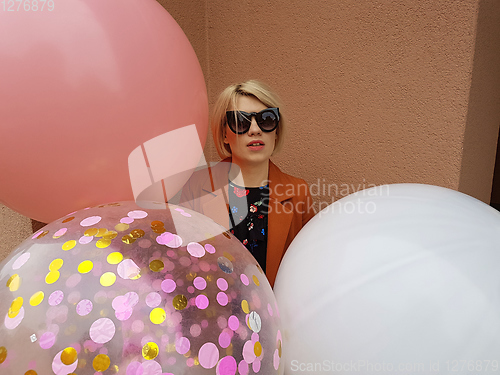 Image of Young fashion happy blonde woman with baloons ,fashion photo, instagram filter