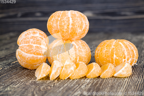 Image of peeled orange juicy tangerine