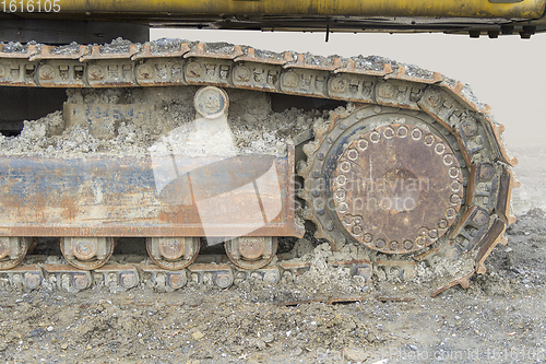 Image of muddy crawler chain detail