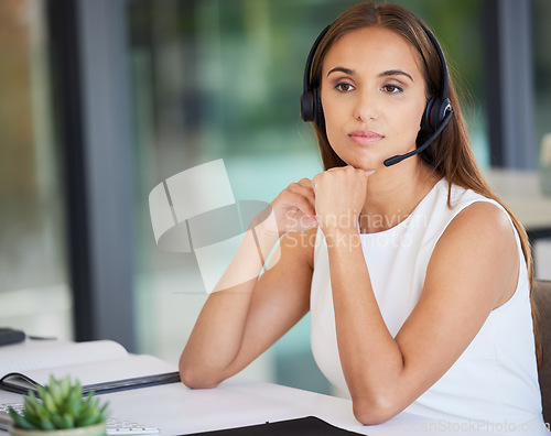 Image of Call center, serious woman and thinking in office of customer service, CRM solution and telecom ideas. Female agent focus with microphone for telemarketing, sales consulting and support at help desk