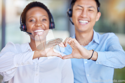 Image of Heart hands, call center and portrait of business people consulting for crm or customer service. Finger, emoji and happy face of telemarketing consultant team smile for contact us, faq and support