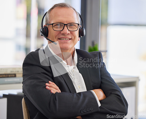 Image of Call center, mature man and arms crossed in portrait for communication, customer service or contact us for faq CRM questions. Happy salesman, microphone and smile for telemarketing support in office