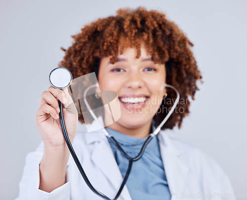 Image of Healthcare, stethoscope and portrait of woman doctor in studio for hospital check up on grey background. Cardiology, health and face of lady cardiologist with heart, lungs and heartbeat medical tool