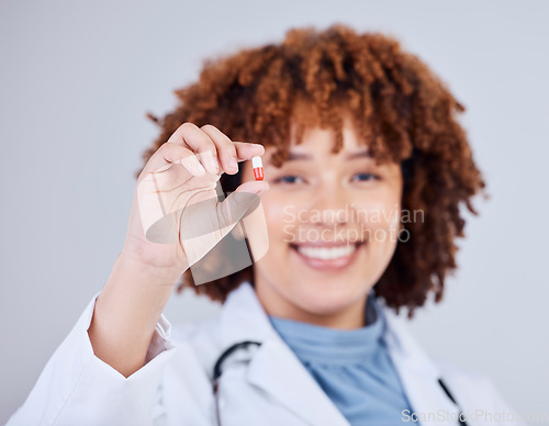 Image of Medicine, pills and doctor with portrait of woman in studio for prescription, supplements or medical. Healthcare, pharmacy and product with female pharmacist on white background for wellness and cure