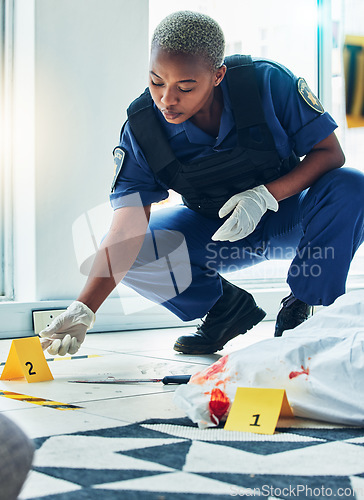 Image of Police woman, crime scene investigation and floor for proof, murder or forensic analysis with focus. Law enforcement officer, murder and monitor evidence with experience, problem solving and justice