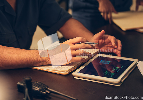 Image of Hands, tablet and book of police on desk for investigation, research and information. Notebook, technology and man writing notes for law enforcement, online browsing and internet database at work.