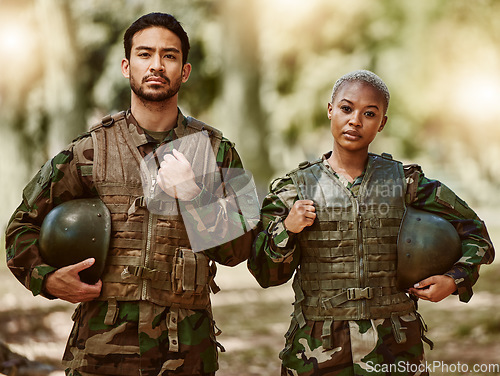 Image of Soldier, military and portrait of man and woman in gear in nature for service, protection and training outdoors. Camouflage, national army and people for battle, operation or combat exercise in woods