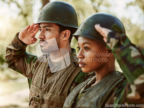 Image of Soldier, military and man and woman salute in nature for service, protection and battle outdoors. War training, national army and people in position for veteran honor, greeting and official duty