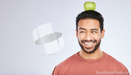 Image of Head balance, thinking or happy man with apple decision for weight loss diet, healthy lifestyle change or nutrition choice. Studio food, fruit mockup space or hungry person ideas on white background