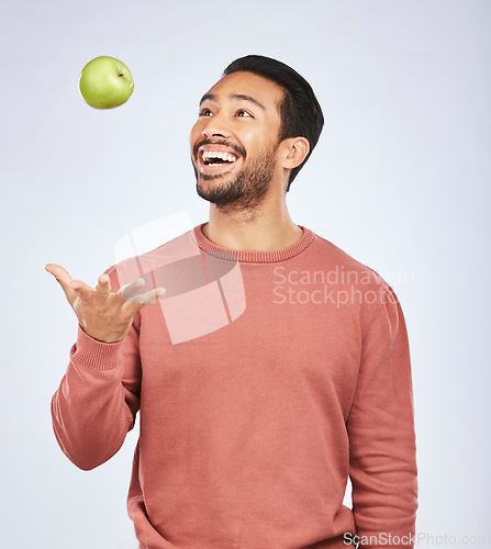 Image of Health studio, throw and happy man with apple product for weight loss diet, healthy food or nutrition meal, vitamin or fiber. Wellness, nutritionist fruit or hungry person excited on white background