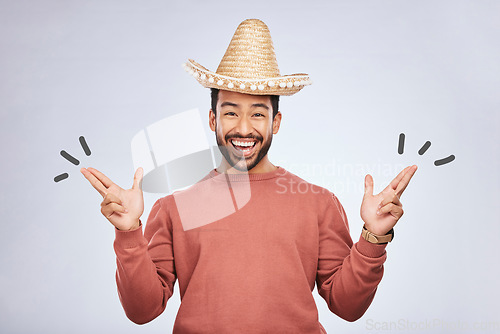 Image of Finger gun, hat and portrait of man in studio with hand gesture for comic, humor and funny joke. Happy, Mexican party accessories and excited male person on gray background with sombrero for comedy