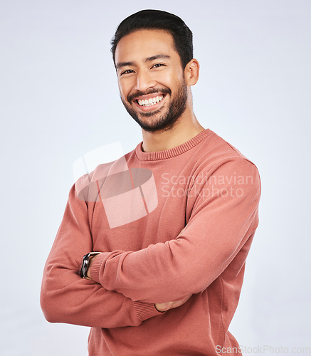 Image of Portrait, smile and Asian man with arms crossed, casual fashion and confident guy against a white studio background. Face, male person and Japanese model with happiness, aesthetic and stylish outfit