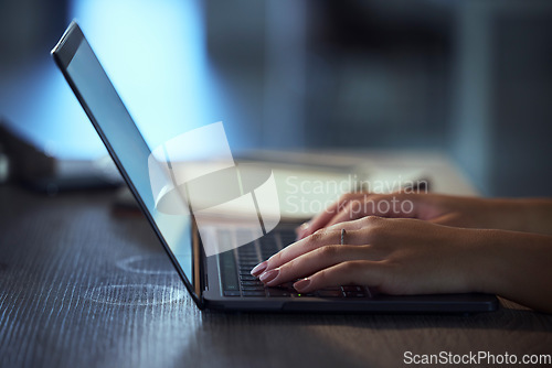 Image of Woman, hands and laptop at night typing email for communication, social media or browsing. Closeup of female person or journalist working late on computer for online chat, networking or copywriting