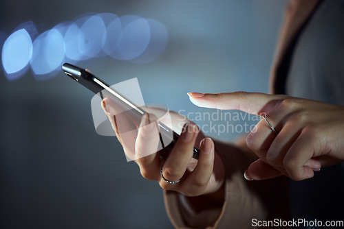 Image of Woman, hands and phone at night for communication, social media or browsing in the city. Closeup of female person or employee working late on mobile smartphone app for online chatting or texting