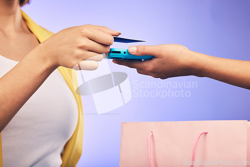 Image of Card machine, shopping and woman hands at POS, online payment and digital service or fashion fintech. Retail credit, bag and cashier, customer or people, point of sale on studio or purple background