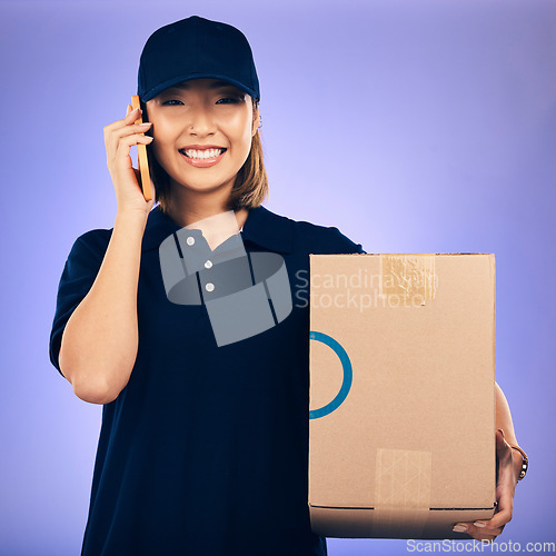 Image of Happy asian woman, phone call and box for delivery, courier service or logistics against a purple studio background. Portrait of female person talking on smartphone with package, parcel or order