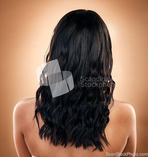 Image of Hair, balayage and beauty, back view of woman with cosmetics and salon treatment on studio background. Haircare, shine and cosmetology, female model has curly hairstyle and grooming with texture