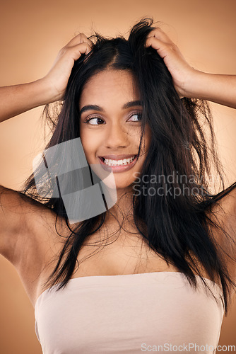 Image of Mess, hair and face of woman in studio with haircare problem, damaged texture and split ends crisis. Salon, beauty and worried female person with hands on head for treatment, hygiene and cleaning
