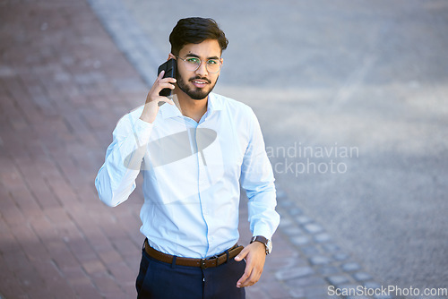 Image of Portrait, indian man and phone call with professional in outdoor for communication with career. Tech, travel and businessman in city or portrait with conversation for technology or work in street.