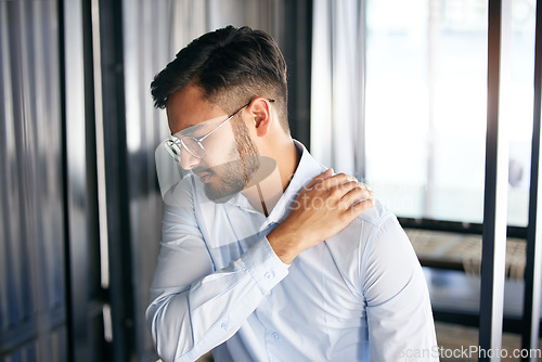 Image of Business man, shoulder pain and problem with health issue and muscle fatigue in an office. Employee, young and male person, professional and injury of worker feeling tired from inflammation at work