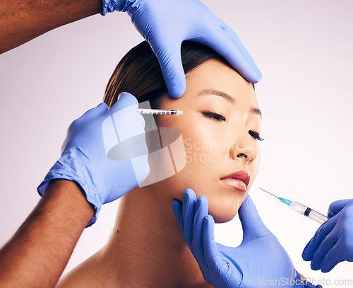 Image of Woman, needle and hands on face for plastic surgery in studio, change and collagen for cosmetic results by background. Japanese model, girl and syringe for lip filler, doctors and transformation