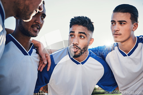 Image of Motivation, football and team captain talking in a huddle planning match strategy for collaboration, teamwork and support. Group, discussion and soccer players in solidarity together for a game