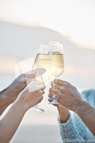 Image of Sunset, friends and hands toast with champagne, having fun or bonding together. Vacation, group and people cheers with wine glass, alcohol or drink for celebration on holiday, summer or party outdoor