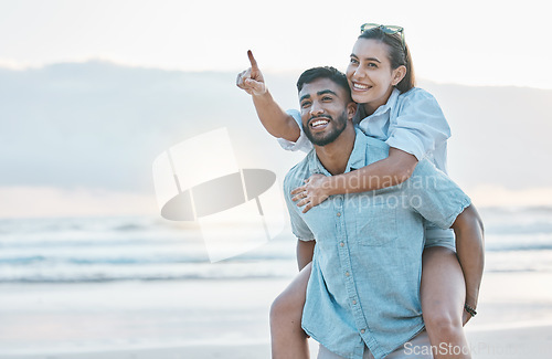 Image of Couple, piggyback on beach and love, travel and holiday, mockup space and happy together outdoor. Summer, support and care with affection, man and woman pointing in nature with adventure by the ocean