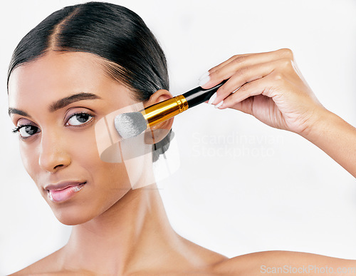 Image of Portrait, skincare and woman with makeup, brush and dermatology against a white studio background. Face, female person and model with cosmetics tool, beauty and luxury with wellness or organic facial