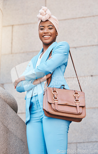 Image of Happy, pride and portrait of a black woman with arms crossed in the city as a lawyer. Smile, confident and an African employee or justice worker working in town as a professional legal entrepreneur