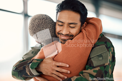 Image of Love, hug and a man soldier with his wife in the airport after returning home from war service as a patriot. Smile, military or army with a happy couple embracing as a welcome to safety and security