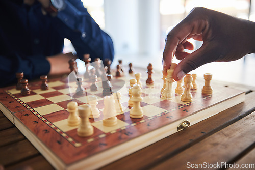 Image of Hands, fun and people with a chess game, strategy and playing together at a competition. Table, professional and friends with a board for gaming, learning and expert with a skill or hobby in a room
