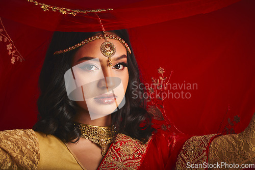 Image of Fashion, veil and portrait of Indian woman with jewellery in traditional clothes, beauty and sari. Religion, culture and face of female person on red background with accessory, cosmetics and makeup
