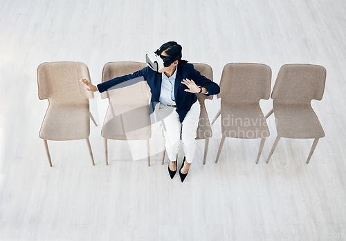 Image of Business woman, vr headset and sitting cyber game with professional in office with innovation work. Virtual reality glasses, female employee and above view with ai, 3d and future platform at job