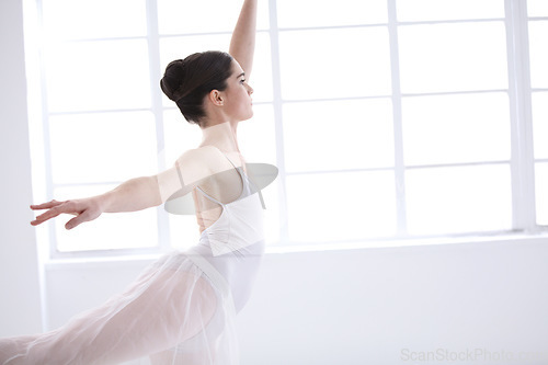 Image of Dance, ballet and window with woman in studio for balance, elegant and performance. Artist, theatre and training with female ballerina dancing in class for competition, freedom and commitment