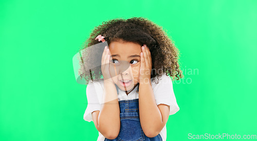 Image of Fear, worried and mistake with a girl on a green screen background in studio feeling nervous or anxious. Portrait, scared and panic with an adorable little female child looking afraid on chromakey