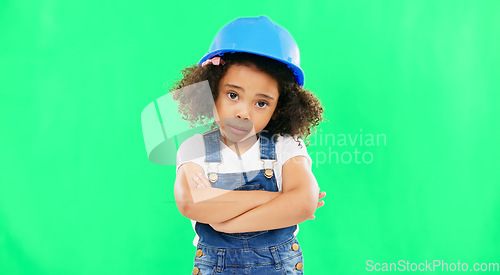 Image of No, green screen and portrait of child shaking head arms crossed feeling sad isolated in studio background. Helmet, safety and annoyed young kid is frustrated, upset and refuse gesture